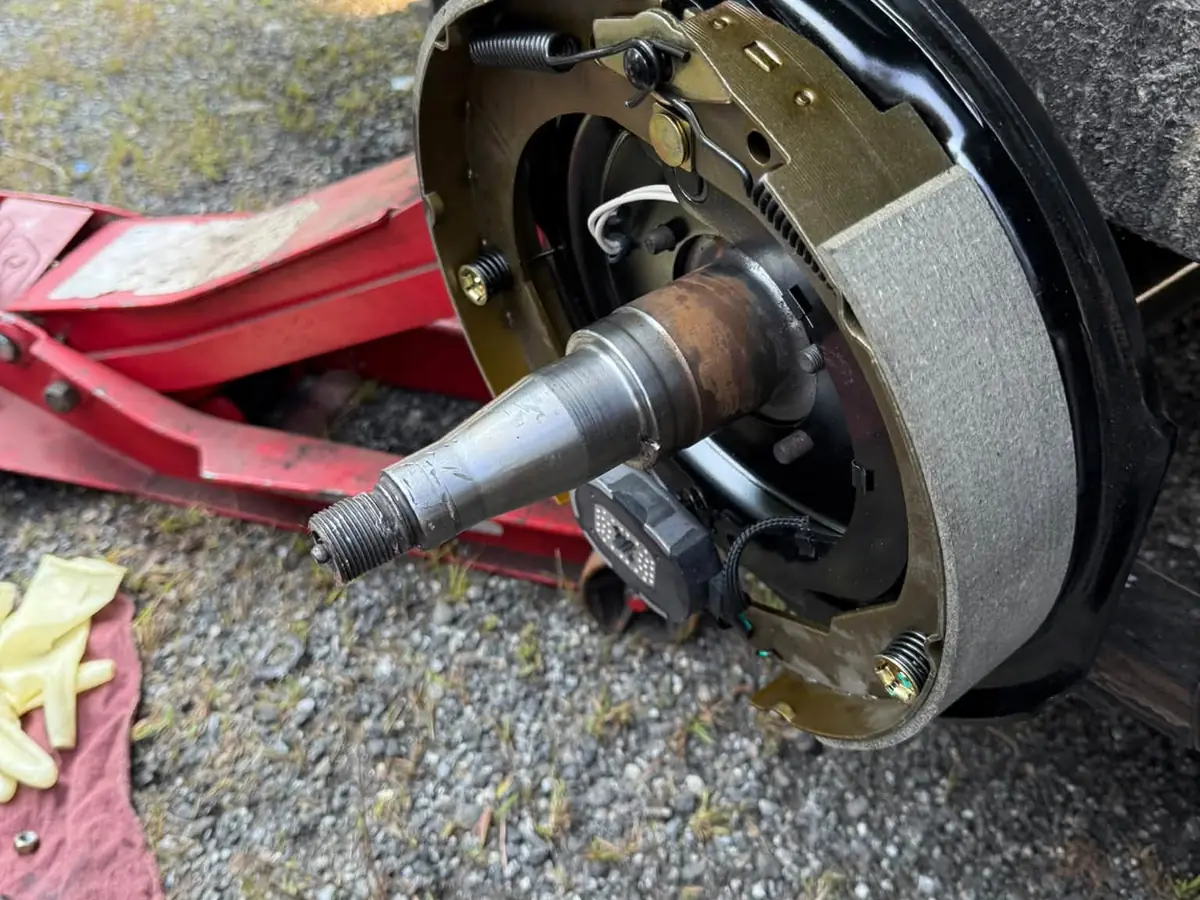 New brake shoes installed on a trailer axle